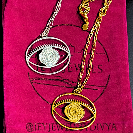 Evil Eye Pendant Necklace Medium - Silver – elegant pendant necklace with spiritual meaning by Jey Jewels by Divya
shown with a gold variation on pink background