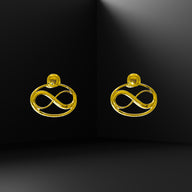 Cosmic Infinity Charm + Studs Earrings Small - Gold – symbolic stud or hoop earrings designed by Jéy Jewels by Divya on black background