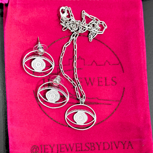 Evil Eye Pendant Necklace Medium - Silver – elegant pendant necklace with spiritual meaning by Jey Jewels by Divya
Show with a pair of Earrings on pink background