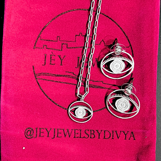 Evil Eye Stud + Hoop Earrings Medium - Silver – symbolic stud or hoop earrings designed by Jey Jewels by Divya
Shown with one Evil Eye necklace smaller size