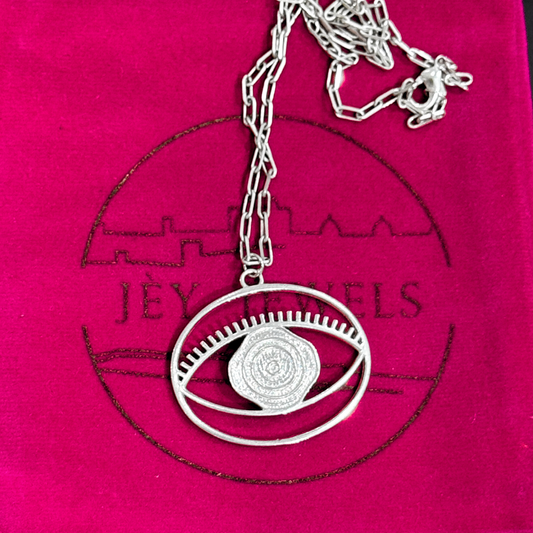 Evil Eye Pendant Necklace Large - Silver – elegant pendant necklace with spiritual meaning by Jey Jewels by Divya
Placed on pink packaging background
