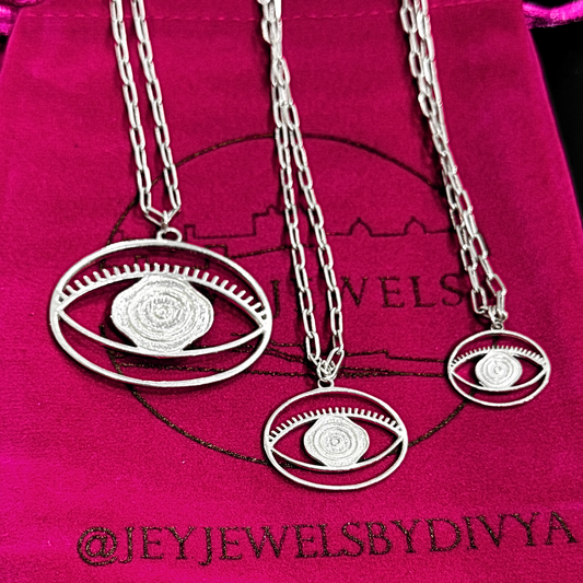 Evil Eye Pendant Necklace Medium - Silver – elegant pendant necklace with spiritual meaning by Jey Jewels by Divya
Shown with two other sizes on pink packaging background
