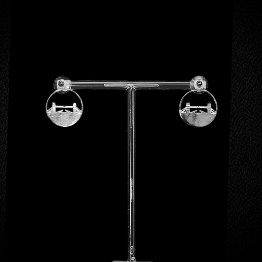 Tower Bridge Medium Earrings – Silver – Intricate detailing inspired by London’s Tower Bridge – heritage architecture in wearable form on dark background