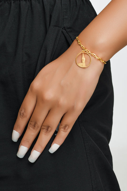 Big Ben Medium Bracelet – Gold – Pendant or earrings inspired by London’s iconic Big Ben tower – elegant architectural design on model hand