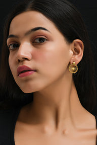 London Eye Medium Earrings – Gold – Circular design inspired by the London Eye – a modern symbol of London’s skyline, architectural jewellery on model ear zoom out