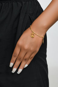 Healing Charms Dangling Bracelet Mix - 1 Small - Gold – handcrafted gold or silver charm bracelet by Jéy Jewels by Divya on model hand