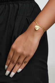 Heart Dangling Bracelet Small - Gold – handcrafted gold charm bracelet by Jéy Jewels by Divya on model hand