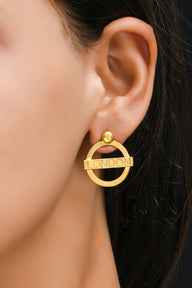 London Medium Earrings – Gold – A tribute to London’s essence – elegant handcrafted jewellery inspired by its iconic cityscape, styled on a model ear zoom in