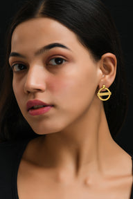 London Medium earrings – Gold – A tribute to London’s essence – elegant handcrafted jewellery inspired by its iconic cityscape, styled on a model ear zoom out