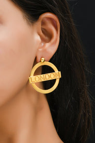 London Large Earrings – Gold – A tribute to London’s essence – elegant handcrafted jewellery inspired by its iconic cityscape, styled on a model ear zoom in