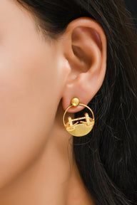 Tower Bridge Medium Earrings – Gold – Intricate detailing inspired by London’s Tower Bridge – heritage architecture in wearable form on model ear, zoom in