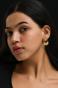 Tower Bridge Medium Earrings – Gold – Intricate detailing inspired by London’s Tower Bridge – heritage architecture in wearable form on model ear, zoom out.