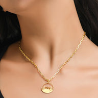 Tower Bridge Medium Necklace – Gold – Intricate detailing inspired by London’s Tower Bridge – heritage architecture in wearable form on dark background