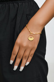 Tower Bridge Medium Necklace – Gold – Intricate detailing inspired by London’s Tower Bridge – heritage architecture in wearable form on model hand