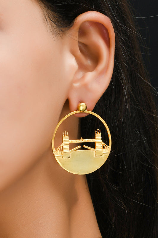 Tower Bridge Large Earrings – Gold – Intricate detailing inspired by London’s Tower Bridge – heritage architecture in wearable form on model ear zoom in