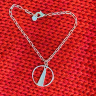 Shard Medium Bracelet – Silver – Sleek silver or gold design inspired by The Shard – London’s tallest skyscraper, contemporary jewellery on red background