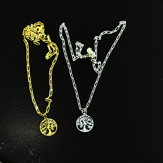 Two necklaces with tree-of-life pendants on a black background gold and silver variation, by Jéy Jewels by Divya