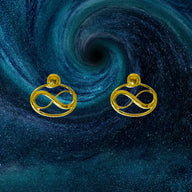 Cosmic Infinity Charm + Studs Earrings Small - Gold – symbolic stud or hoop earrings designed by Jéy Jewels by Divya on cosmic background